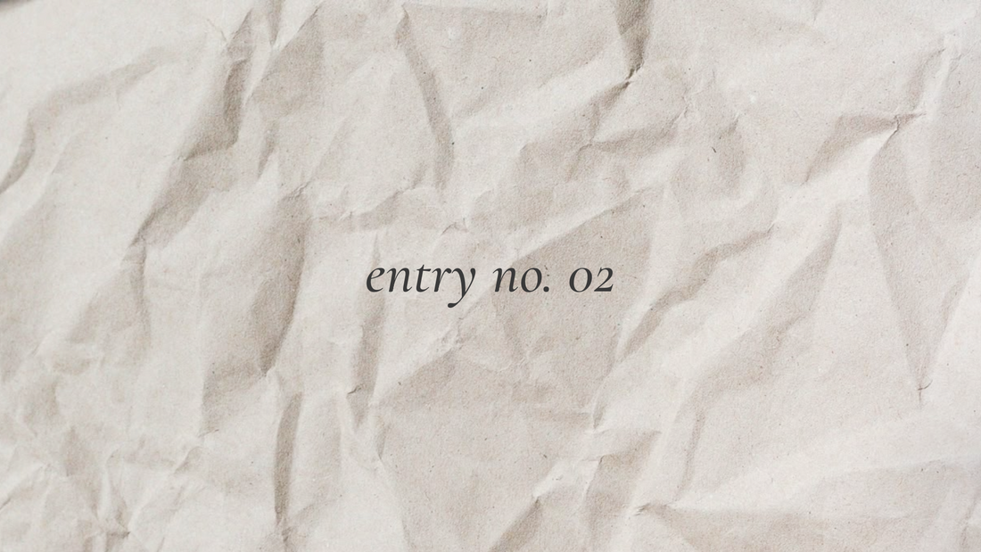 soft paper background with ‘entry no. 02’ written in script